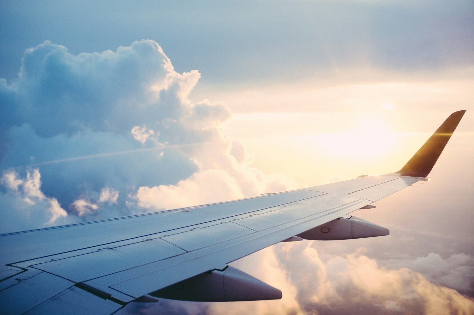 An aircraft wing above cloud on a long-haul route