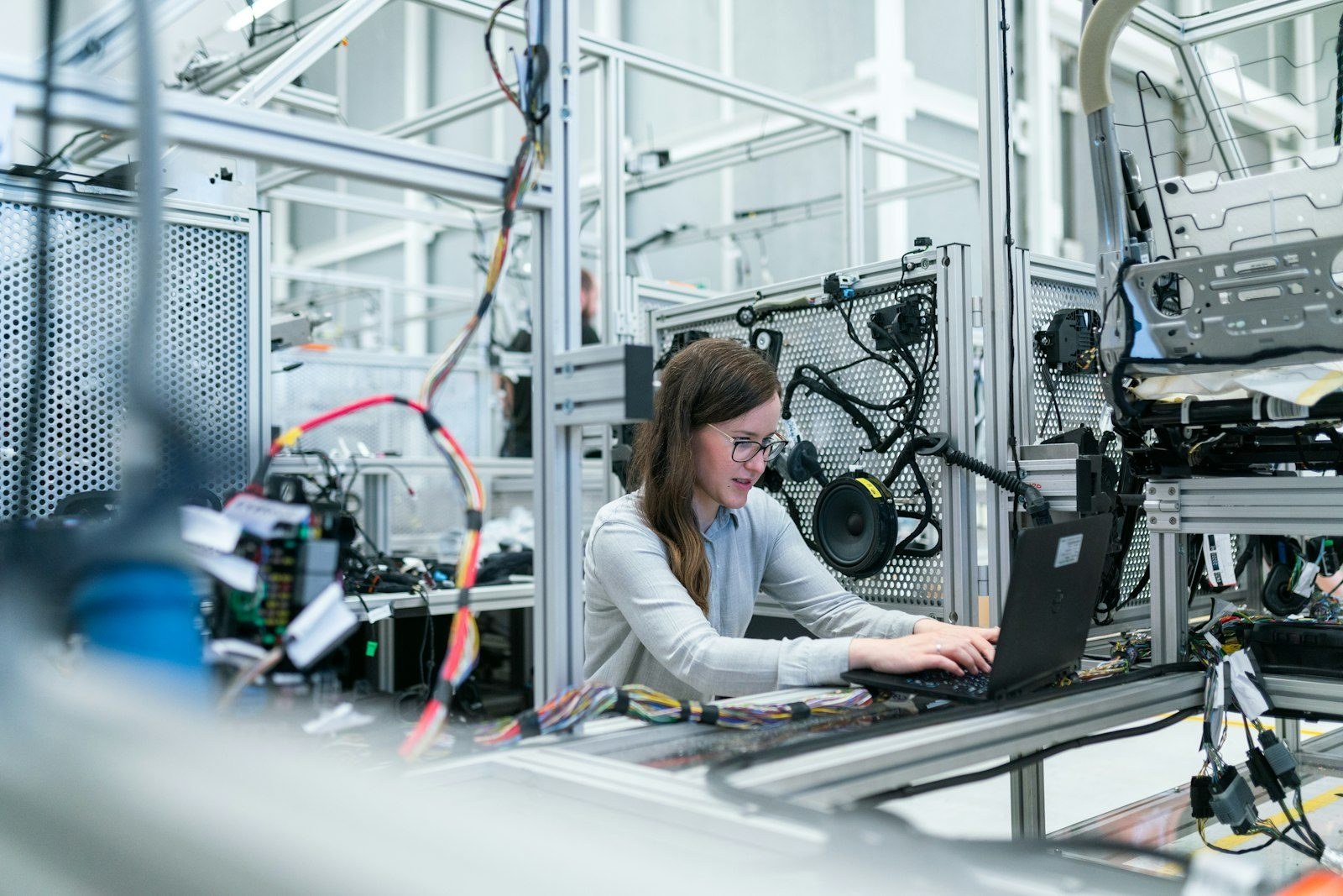 An engineer at an electronics assembly station