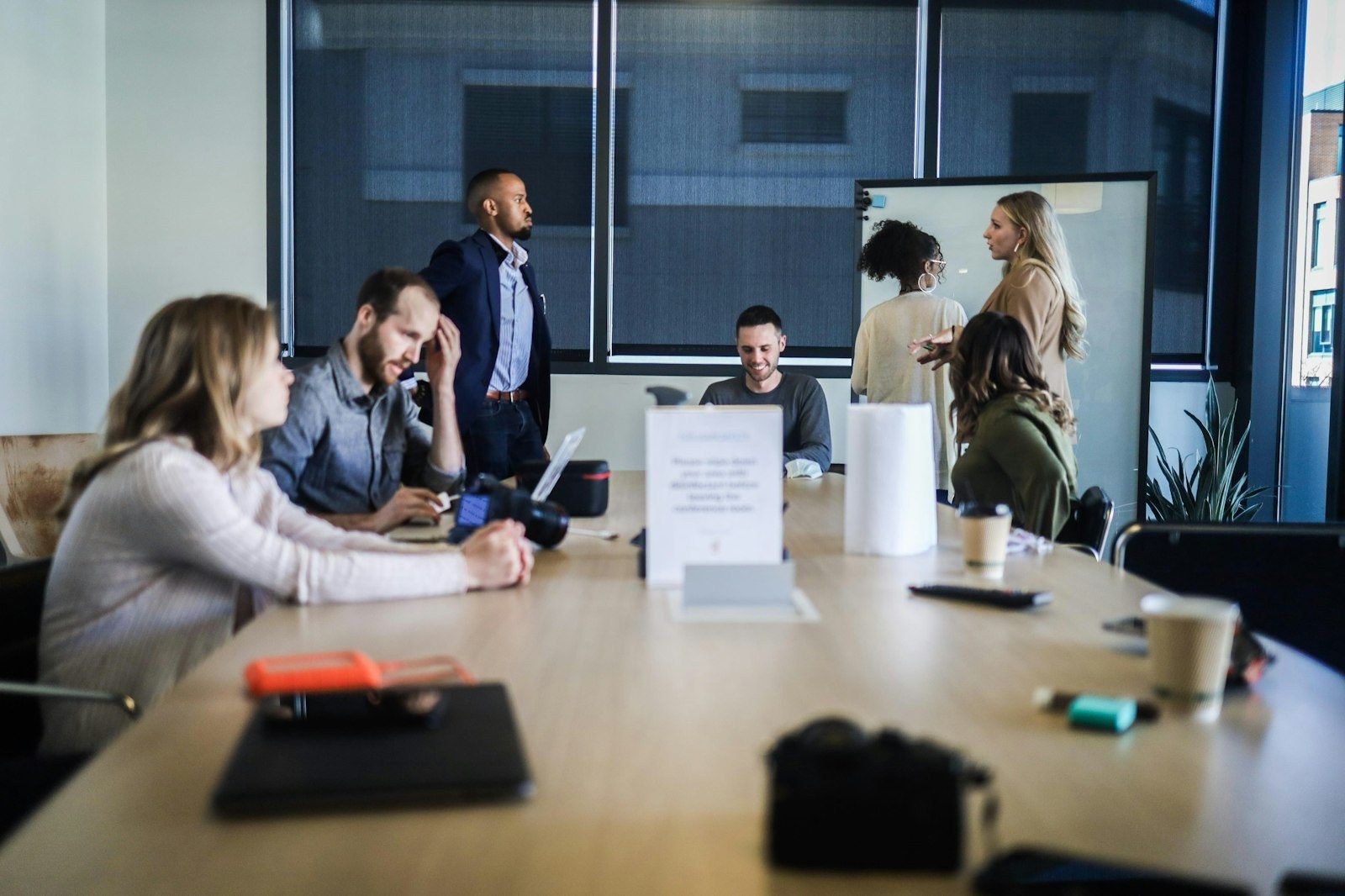 A leadership team in discussion around a table